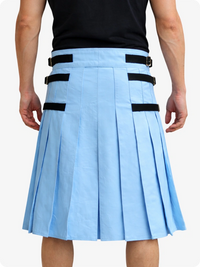Person wearing a Sky blue pleated skirt with black straps on a white background