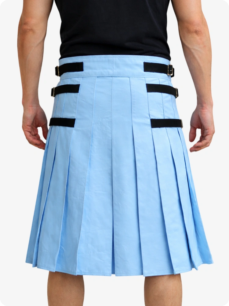 Person wearing a Sky blue pleated skirt with black straps on a white background