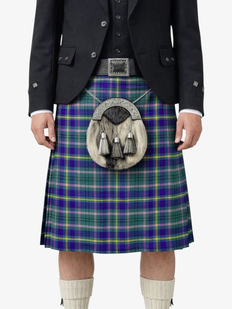 Person wearing a tartan kilt with a jacket on a white background