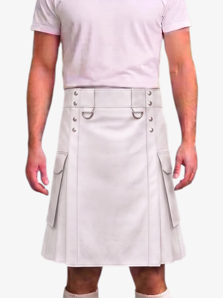 A man wearing a light beige faux-leather kilt with belt details, silver-tone hardware, and side cargo pockets, paired with a matching light pink t-shirt.