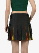 Black pleated skirt with colorful accents worn by a person on a white background