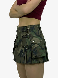 Camouflage skirt with metal buckles worn by a person on a white background